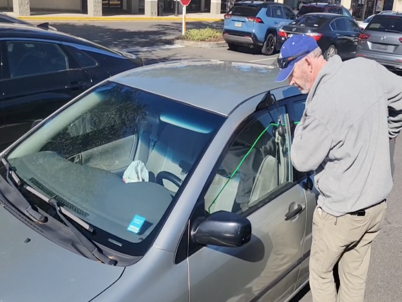 Paul retrieving keys from car where driver had locked the keeys inside of vehicle.